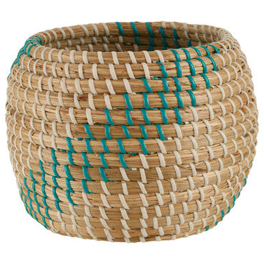 Woven basket with blue accents on a white background