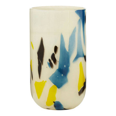 Ceramic tumbler with abstract blue, yellow, and black design on a white background