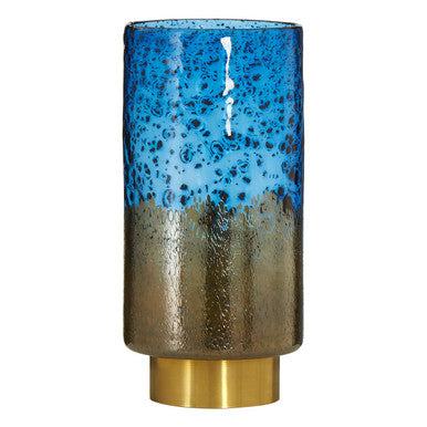Cylindrical ceramic vase with blue and gold gradient on a white background