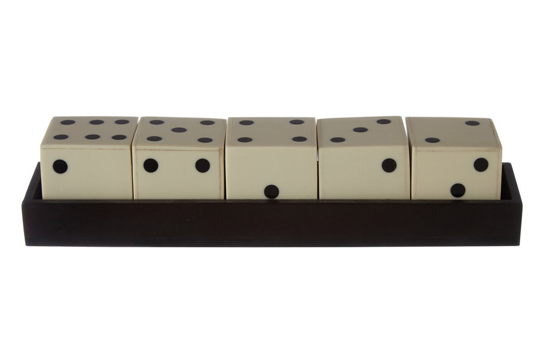 Set of five dice with black dots on a beige background
