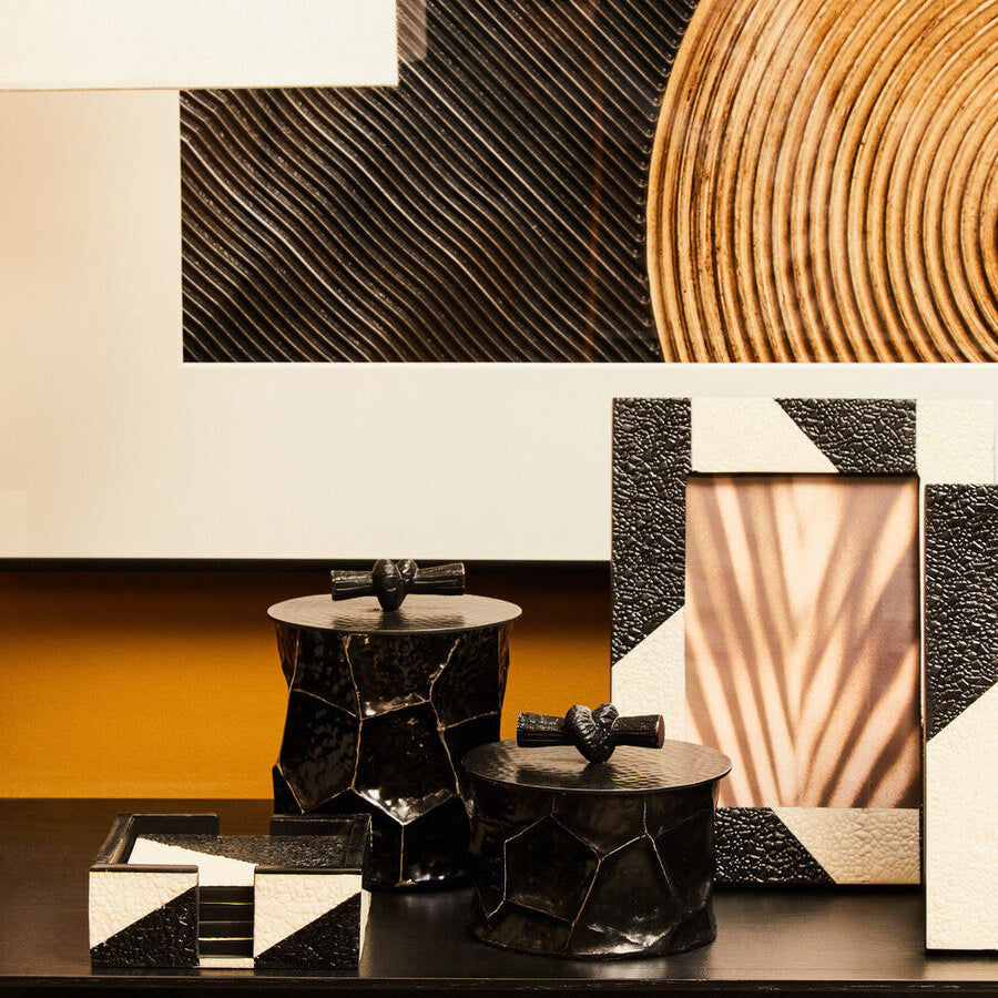 Modern bathroom with geometric wall art and black vanity