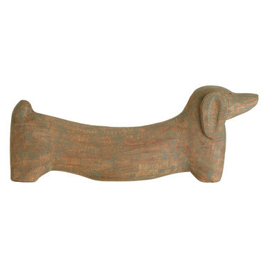 Wooden dachshund-shaped object on a white background