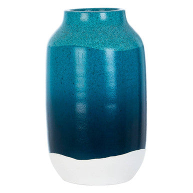 Blue ceramic vase with a white base on a white background