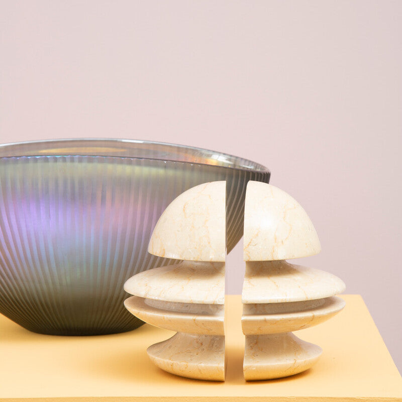 Two ceramic bowls on a light pink background