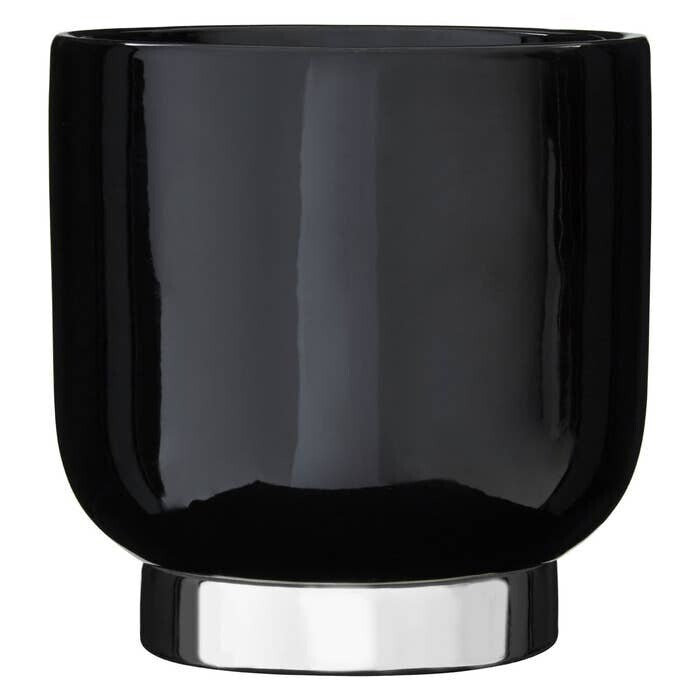 Black glass with silver base on a white background