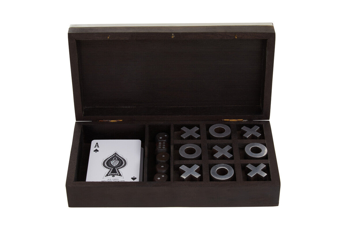 Wooden box with playing cards and game pieces on a white background
