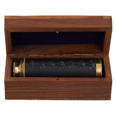 Wooden box with a black cylindrical object inside on a white background