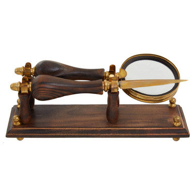 Wooden and brass device on a white background