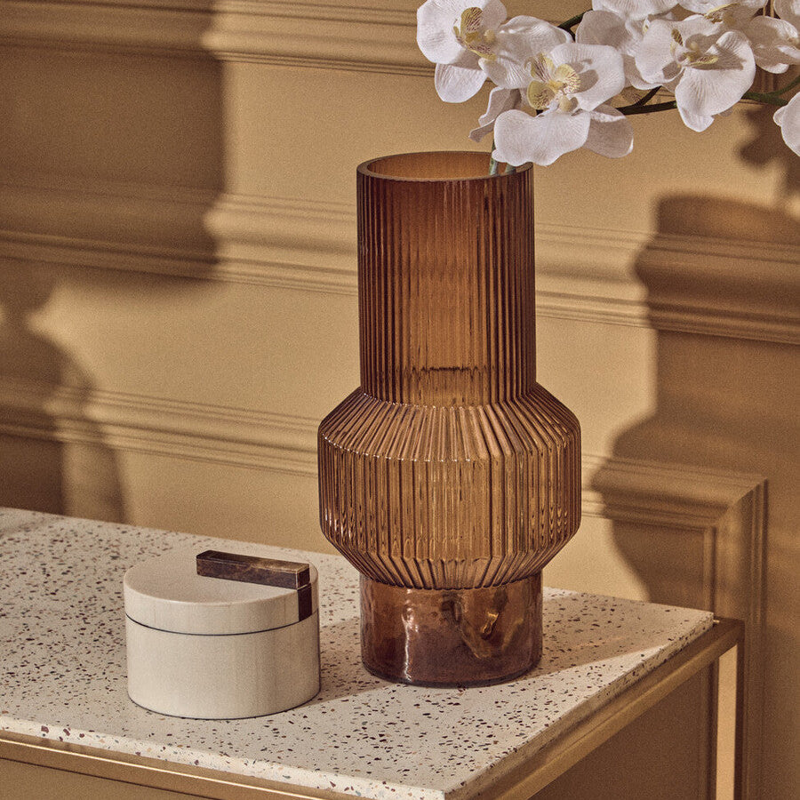 Decorative vase on a table with a neutral background