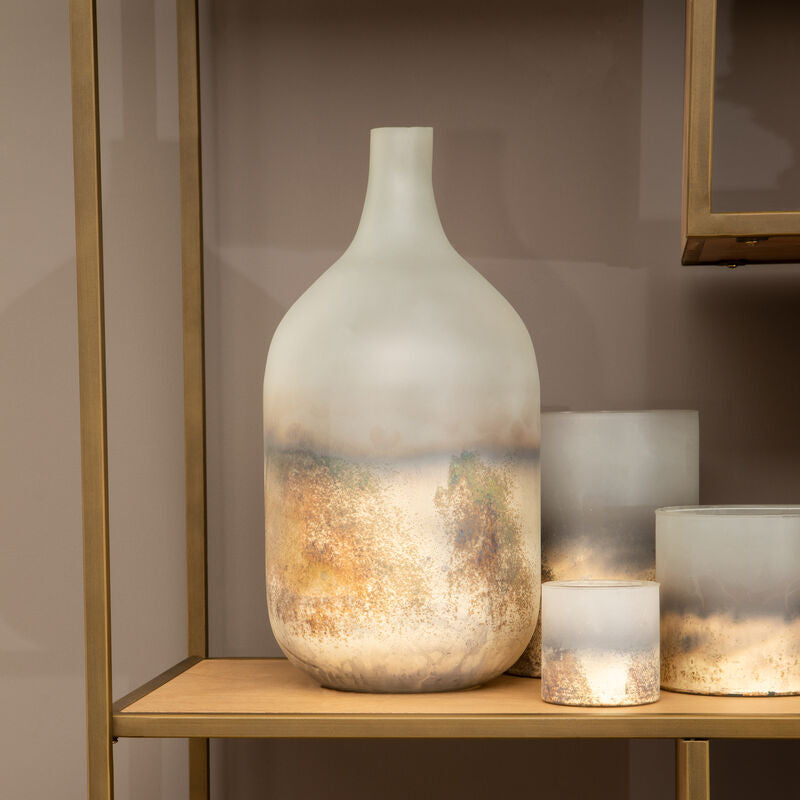 Decorative vases on a wooden shelf against a neutral wall