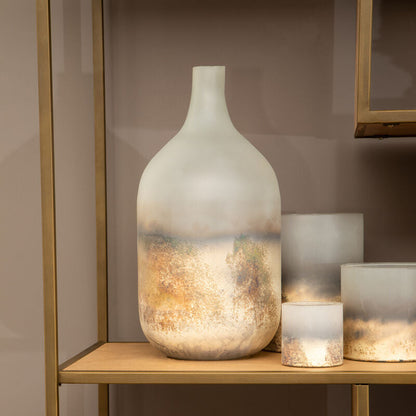 Decorative vases on a wooden shelf against a neutral wall