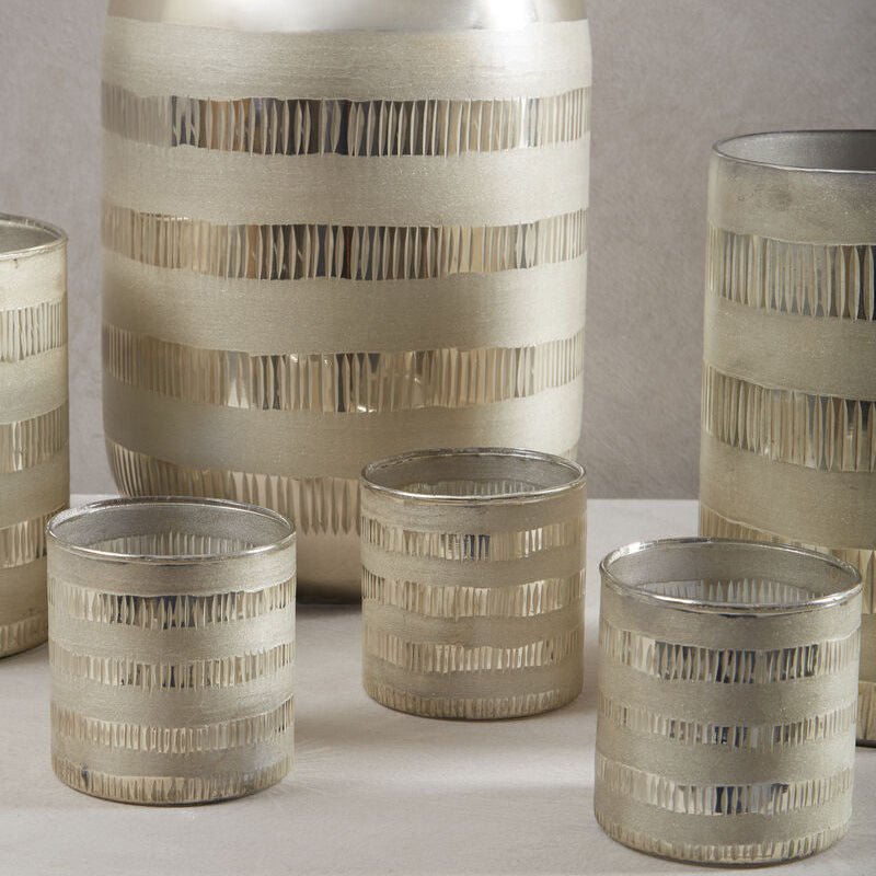 Set of decorative vases with striped patterns on a neutral background
