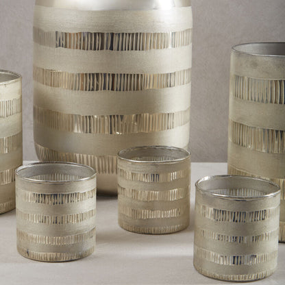 Set of decorative vases with striped patterns on a neutral background