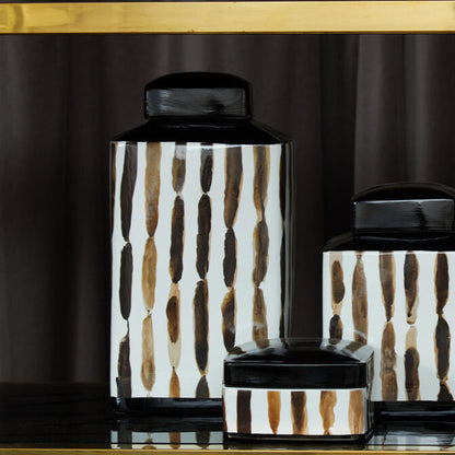 Set of decorative jars with a geometric pattern on a dark background