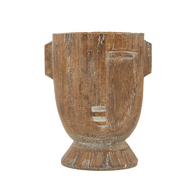Wooden vase with face design on a white background