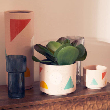 Decorative vases with geometric patterns on a wooden surface