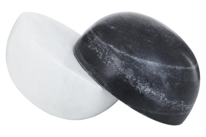 Black and white stone-like objects on a white background