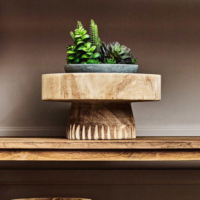 Two wooden planters on a shelf with a small succulent arrangement on a wooden stand above.