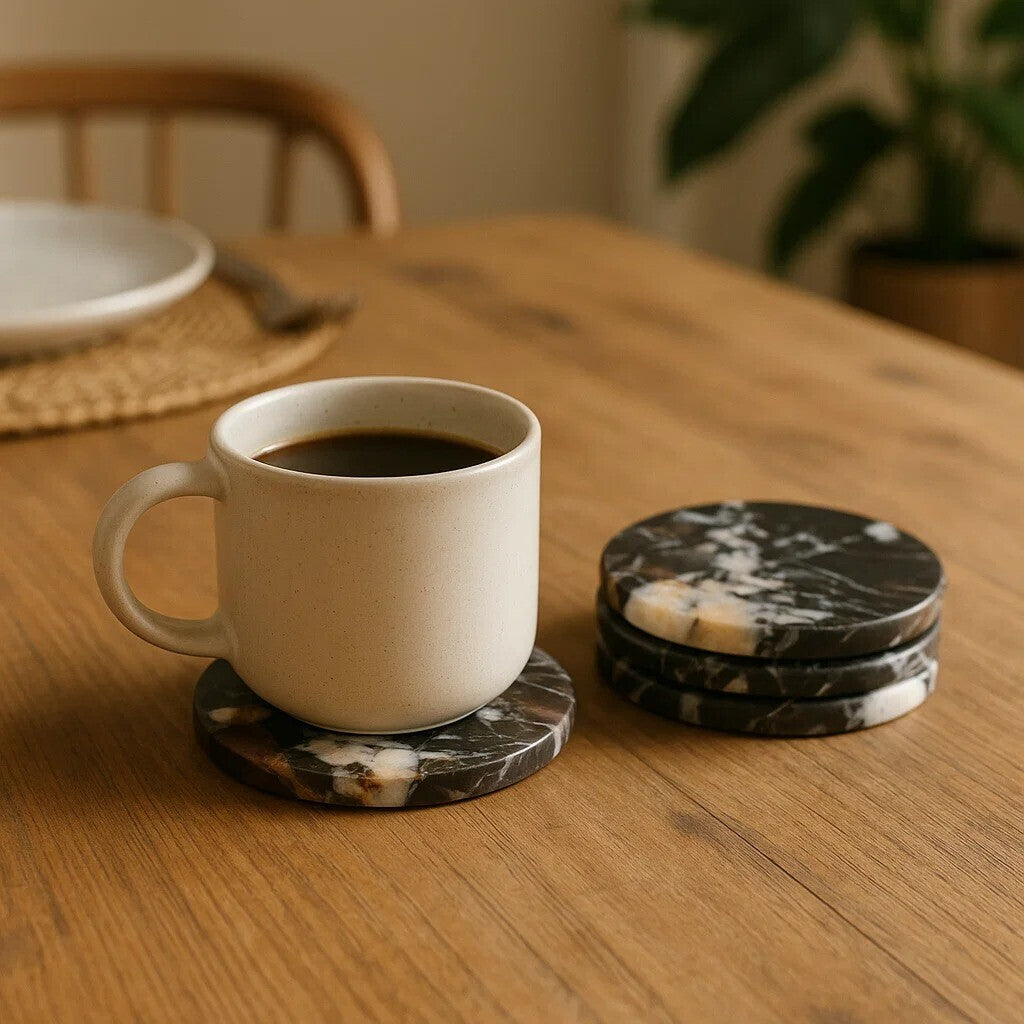 White mug with coffee on a wooden table with marble coasters