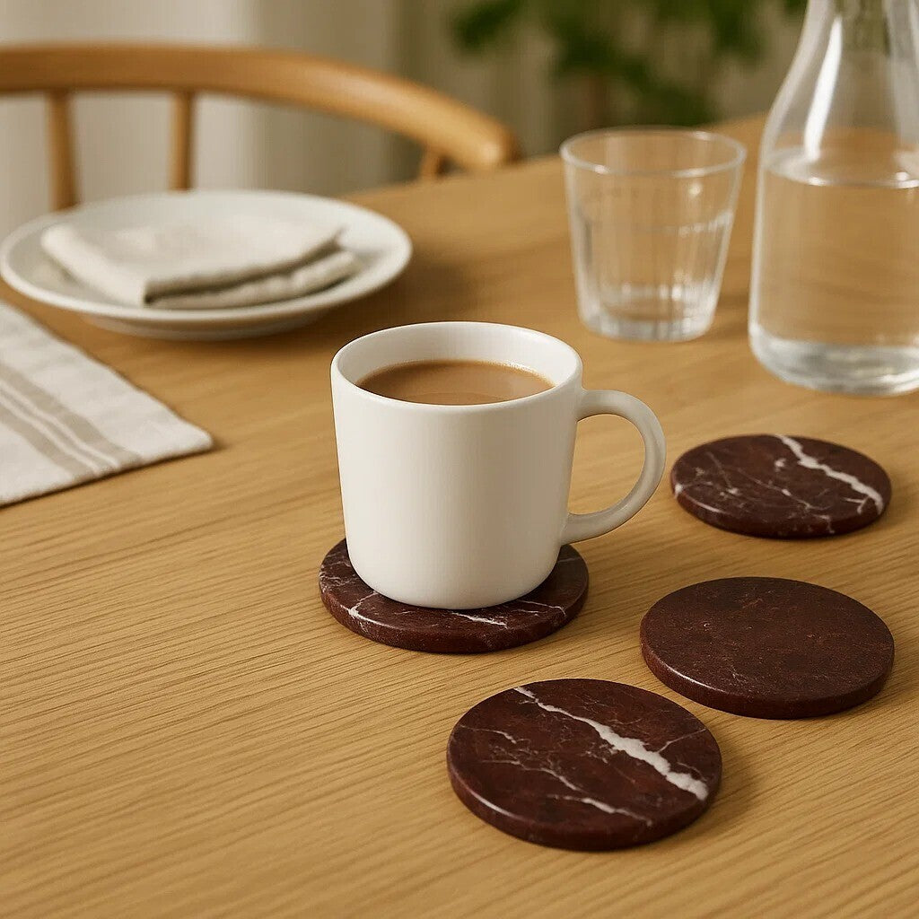 White mug with coffee on a wooden table with marble coasters