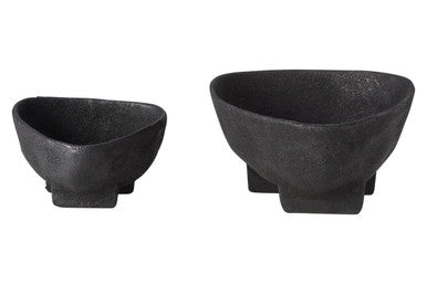 Two black ceramic bowls on a white background