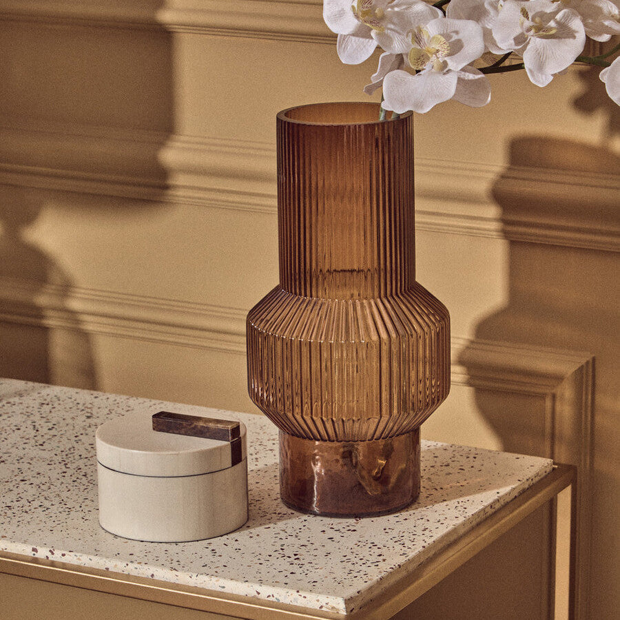 Decorative vase on a table with a neutral background