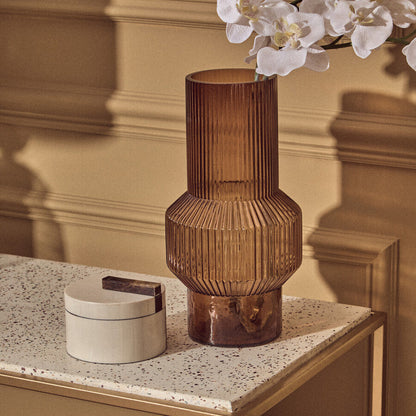 Decorative vase on a table with a neutral background
