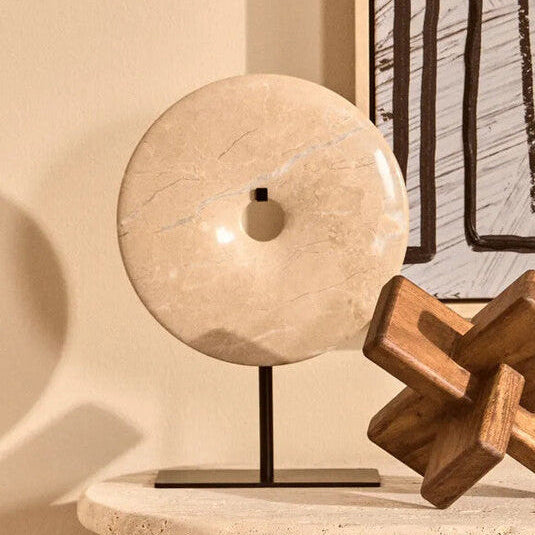 Wooden puzzle on a table with abstract art in the background
