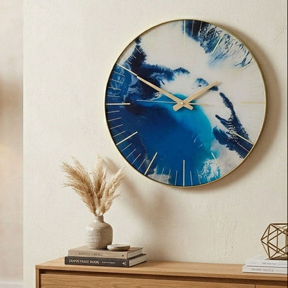 Living room with a large decorative clock on the wall, wooden coffee table, and blue sofa.