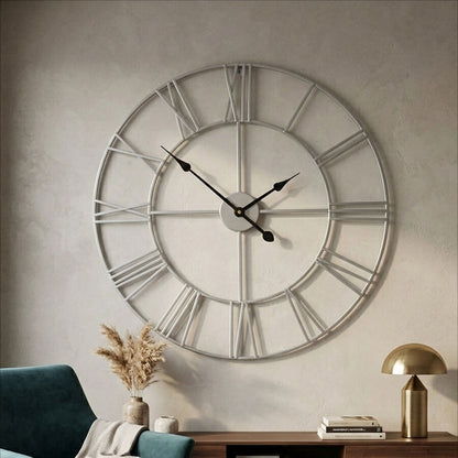 Large decorative wall clock in a living room setting with a sofa and coffee table.
