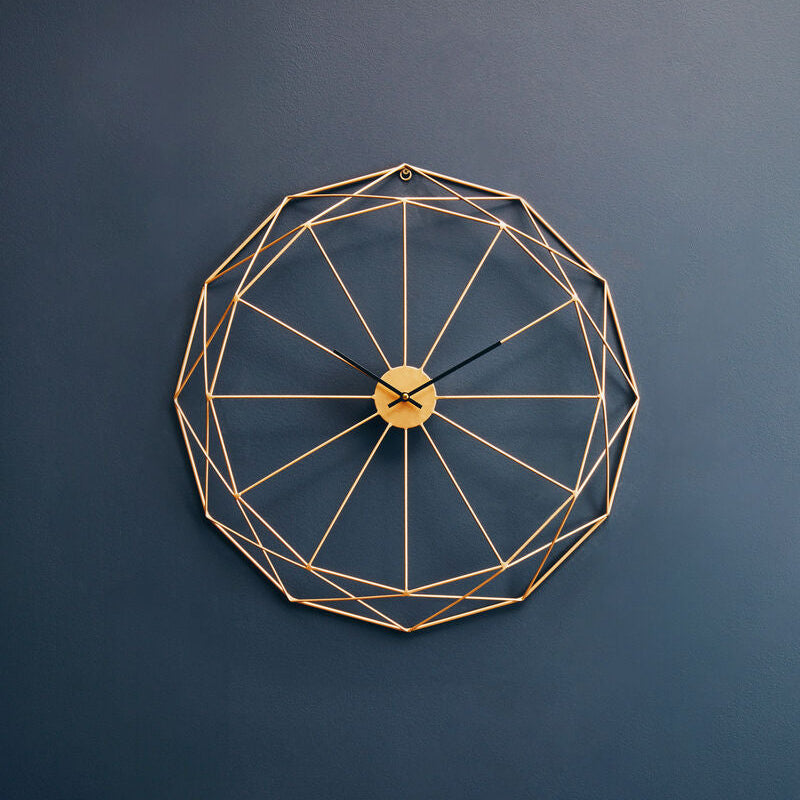 Geometric wall clock on a dark blue wall
