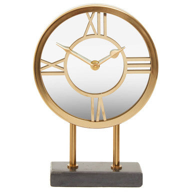 Decorative table clock with gold frame and Roman numeral markers on a white background