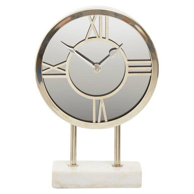Decorative table clock with gold rim and Roman numeral markers on a white background