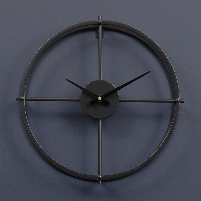 Black wall clock on a dark blue wall