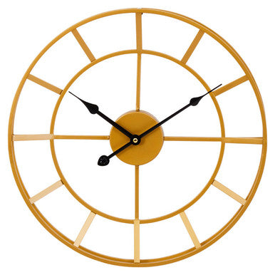 Gold wall clock with black hands on a white background