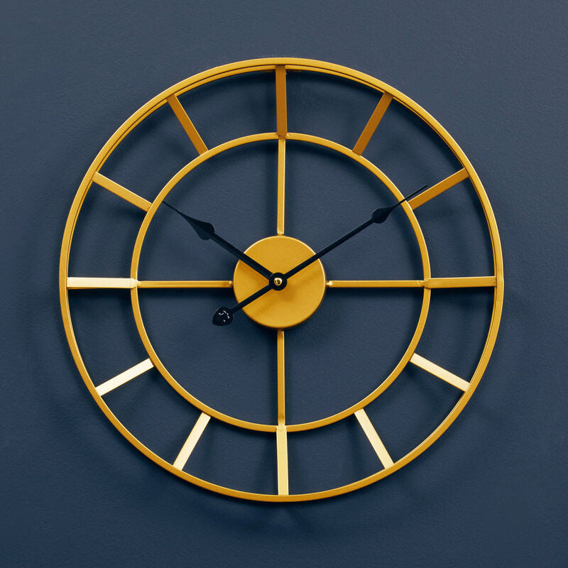 Gold wall clock on a dark blue background