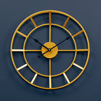 Gold wall clock on a dark blue background