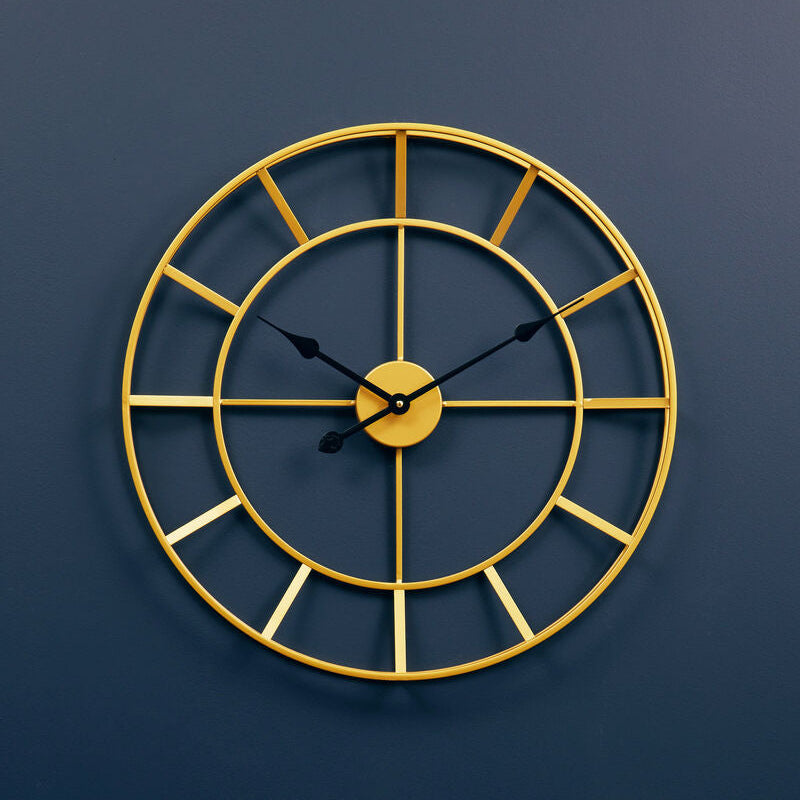 Gold wall clock on a blue wall