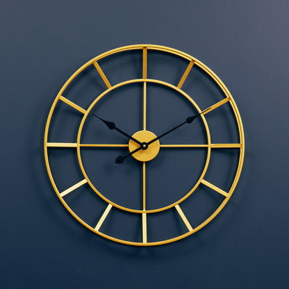 Gold wall clock on a blue wall