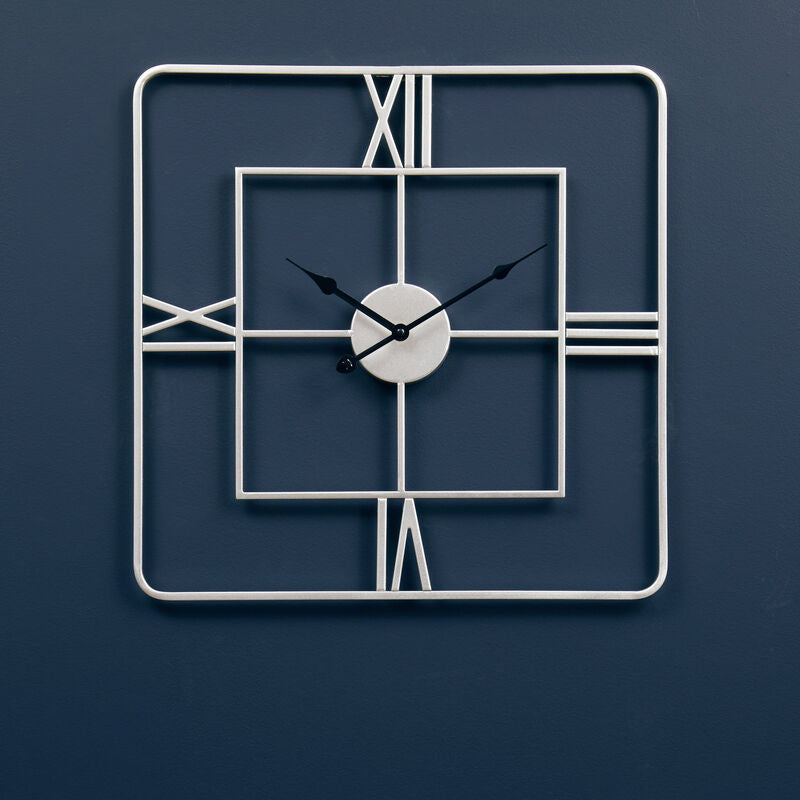 Modern wall clock with geometric design on a dark blue background