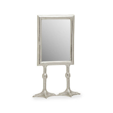 Decorative mirror with a metallic frame on a white background