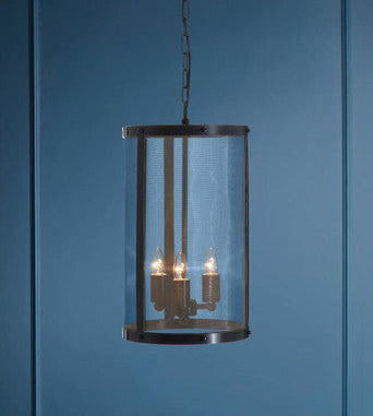 Pendant light fixture against a blue wall