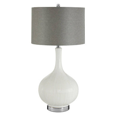 Table lamp with a white ribbed base and gray shade on a white background