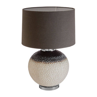 Table lamp with a textured base and dark gray shade on a white background