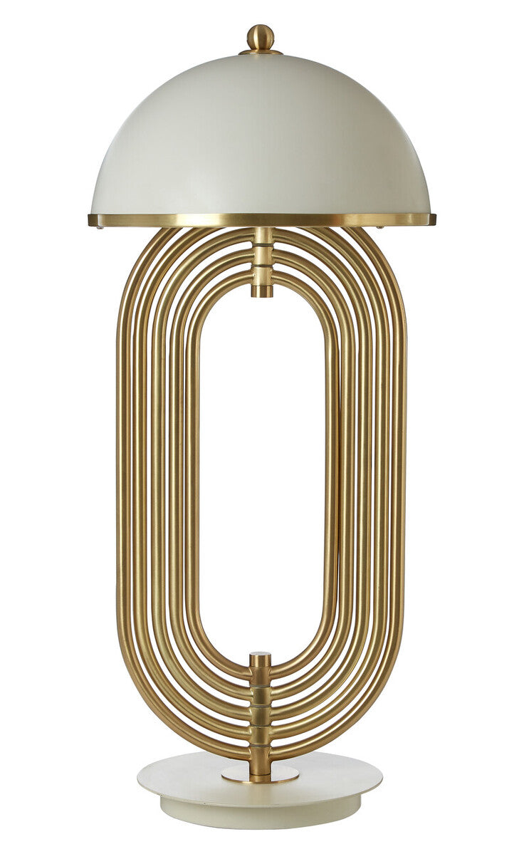 Decorative table lamp with gold metal base and white shade on a white background