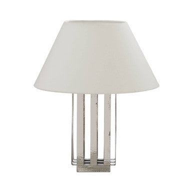 Table lamp with a white shade and metallic base on a white background