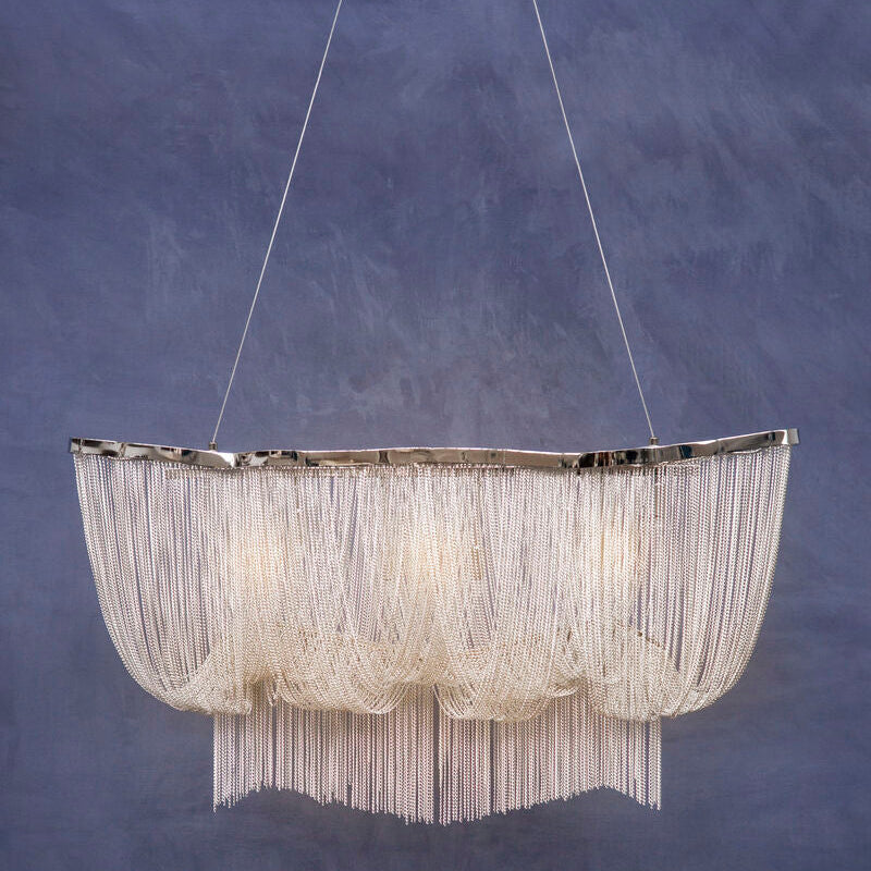 Chandelier with a textured design against a blue background