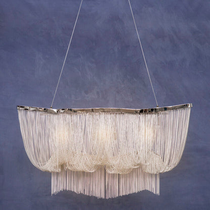 Chandelier with a textured design against a blue background