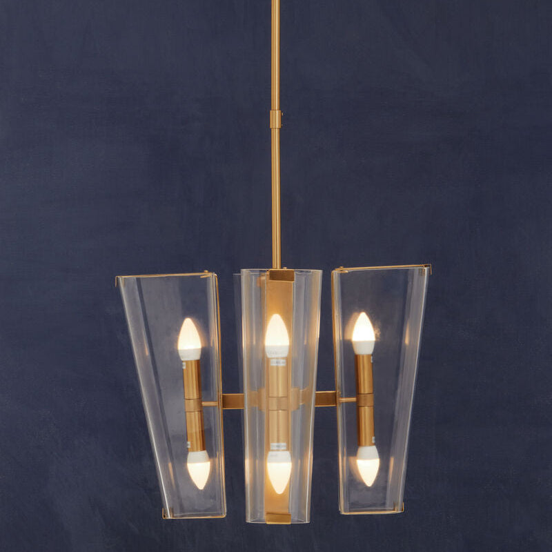 Modern pendant light with clear glass shades on a dark blue background