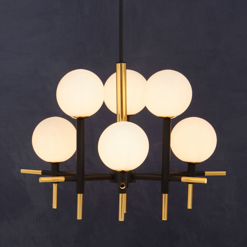 Modern chandelier with six round glass lights on a dark background